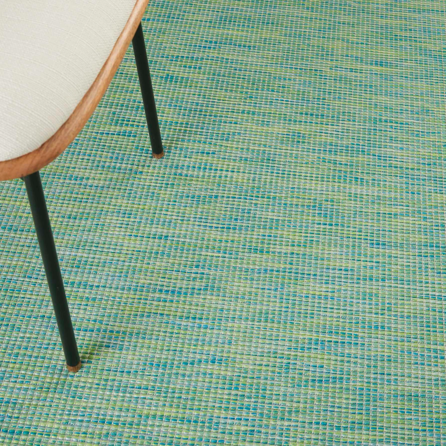 Positano Rug Blue Green Close Up of Rug with Chair on Top